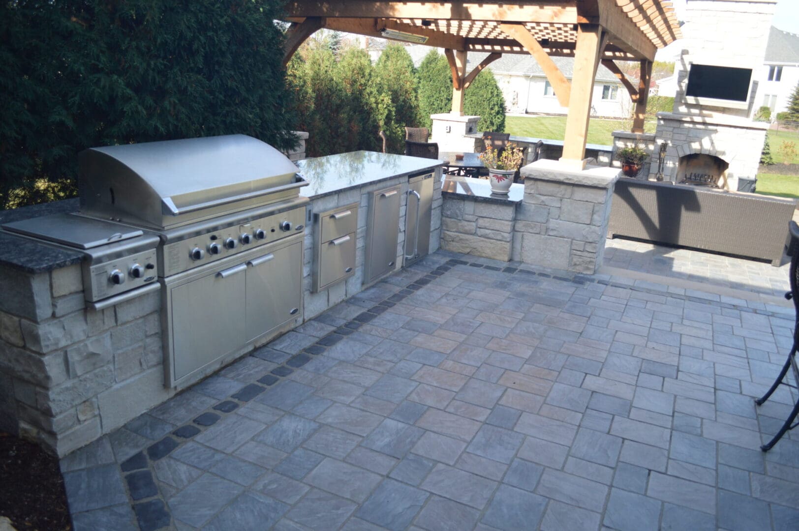 Custom patio with outdoor grill cabinet installation in Burr Ridge, IL