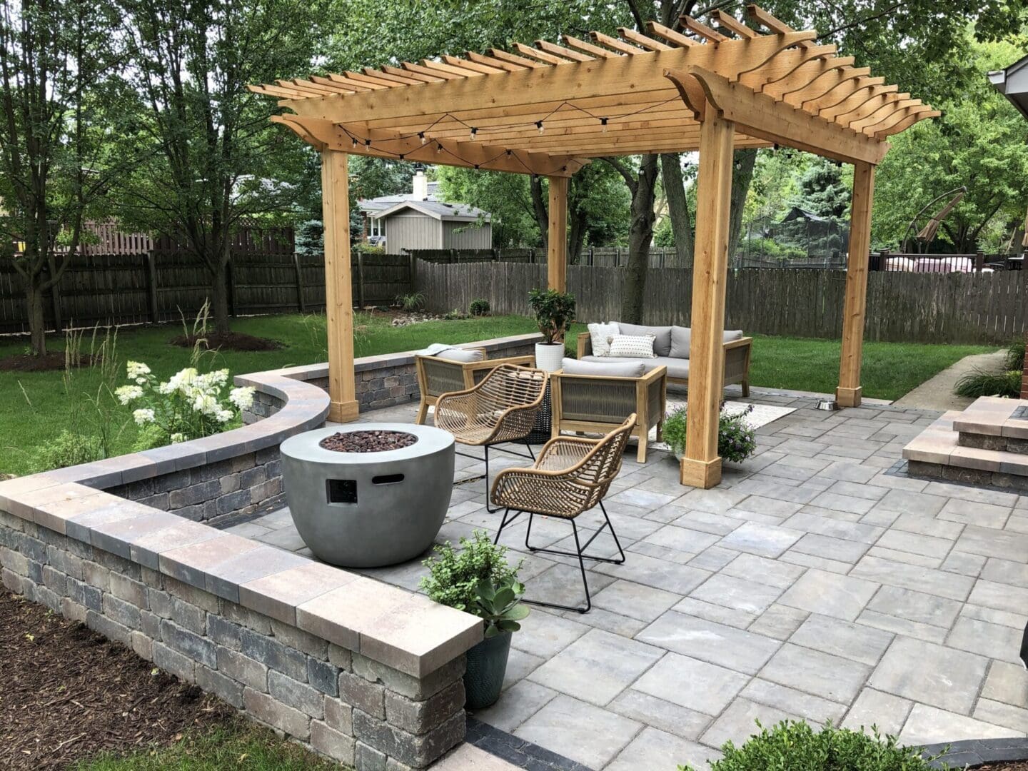 Wood pergola with patio and seating wall installation in Downers Grove, IL