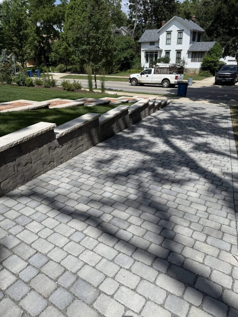 Permeable paver driveway with professional retaining wall installation in Downers Grove, IL