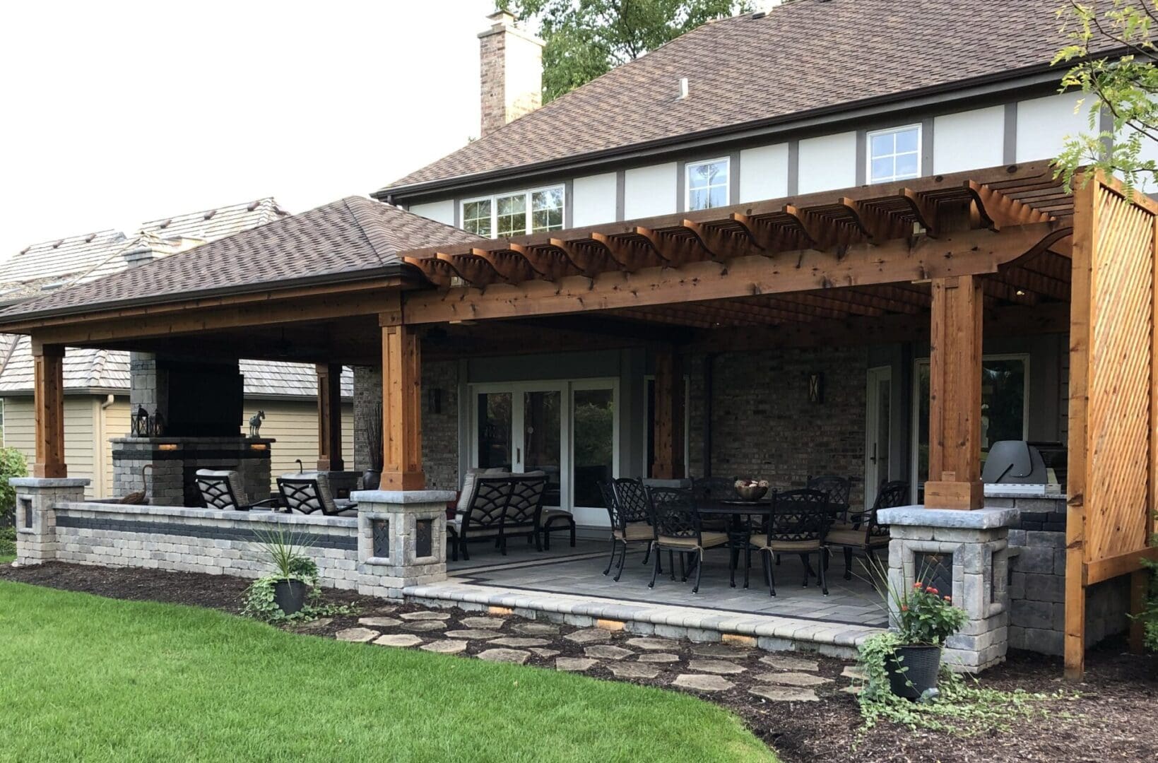 Outdoor pavilion with pergola-style design and seating area installation in Glen Ellyn, IL