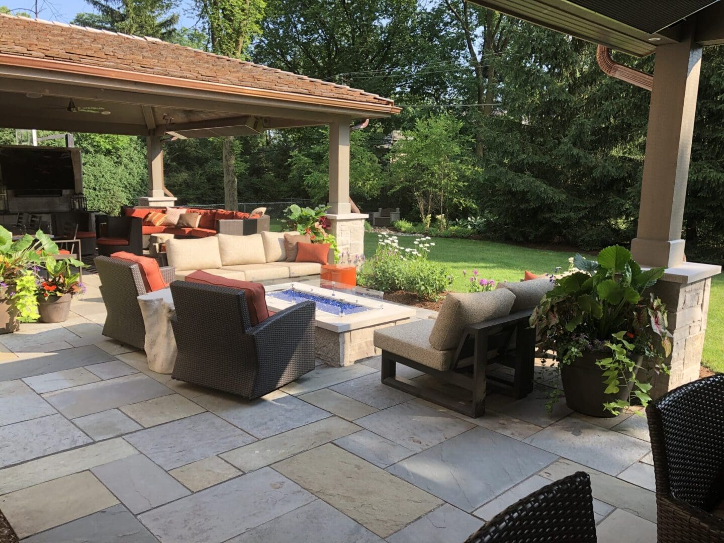 Luxury outdoor living space with custom fire pit, pergola style pavilions in Clarendon Hills, IL