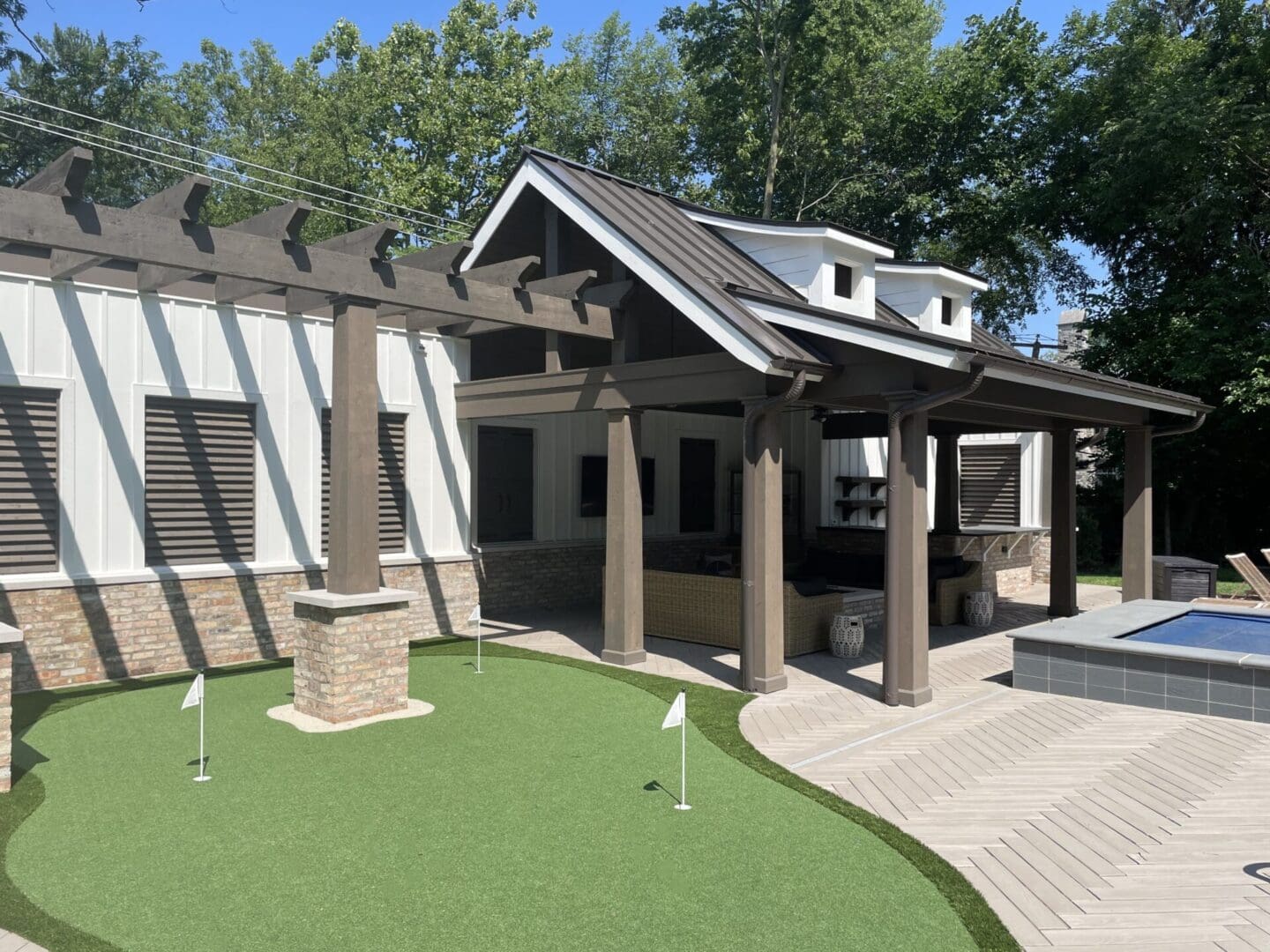Custom putting green installation in luxury outdoor living space in Hinsdale, IL