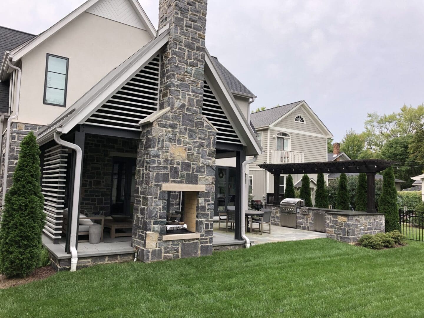 Pavilion and pergola structure in backyard outdoor living space in Naperville, IL